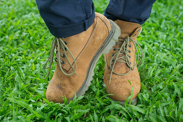 istock Boots on grass background/A vintage boots on grass,selective foc 488531946