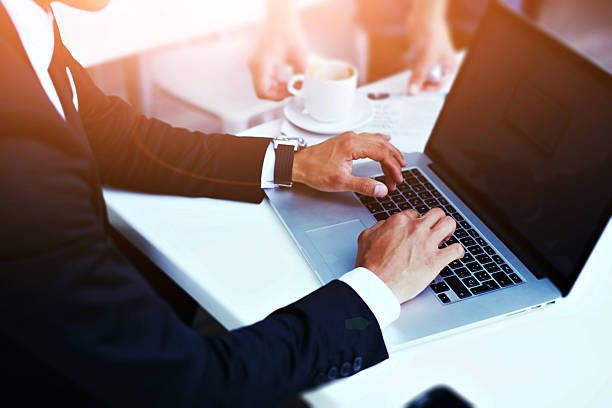 istock Intelligent man working on net-book in a cafe during breakfast 488532262