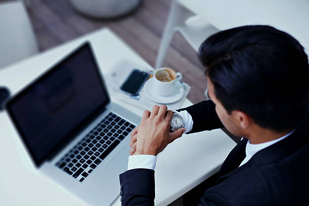 istock Young wealthy businessman sitting in cafe with laptop computer 488532302