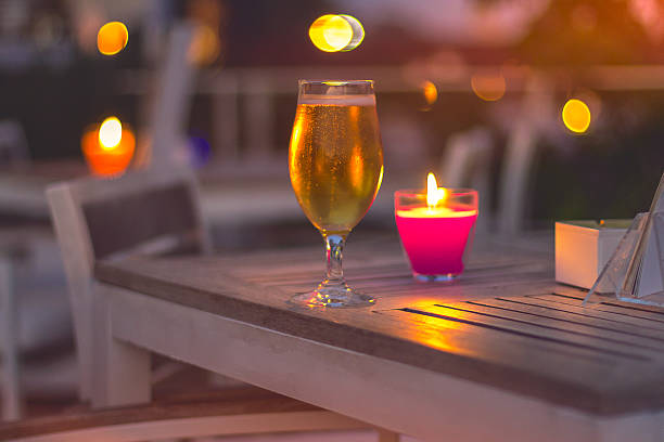 istock Beer on wooden table , romantic place 488532586