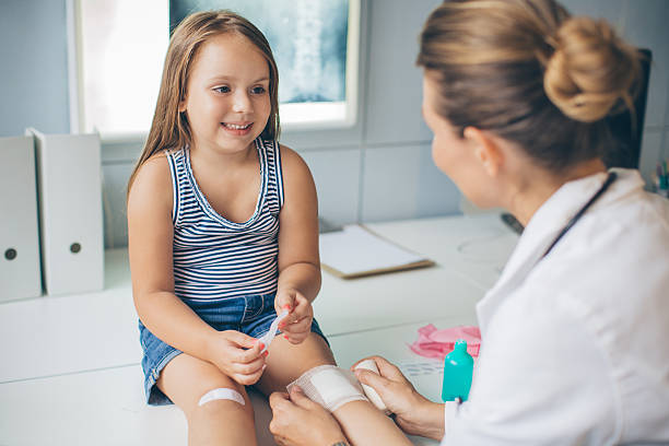 istock Cute girl at doctor's office. 488534972