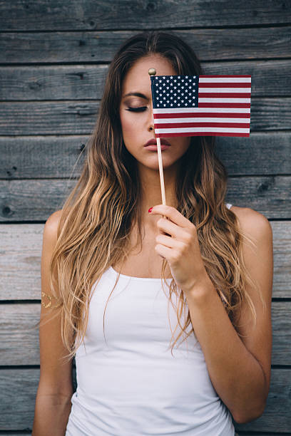 istock Young woman with American flag. 488535838