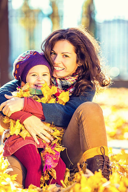 istock Mother and daughter in the park 488536628