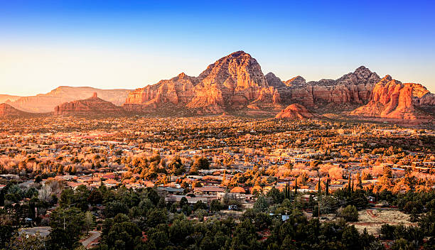 Sedona at sunset Birds eye view to the city of Sedona, Arizona and the Red Rocks at sunset red rocks state park arizona photos stock pictures, royalty-free photos & images