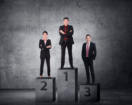 Business person standing on the podium. Business reward concept