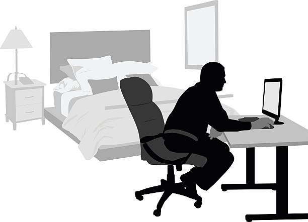 Home Bedroom Office A vector silhouette illustration of a mature man working on his computer in his bedroom. working at home study desk silhouette stock illustrations