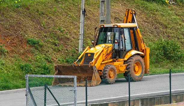 Photo of JCB machine on the road