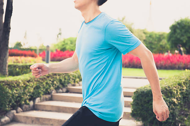 istock Runner athlete running during sunrise in public park 488548344
