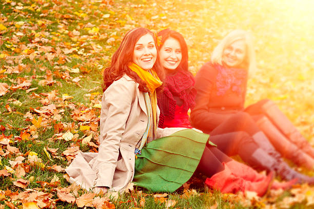 istock young women in the autumn park 488550294
