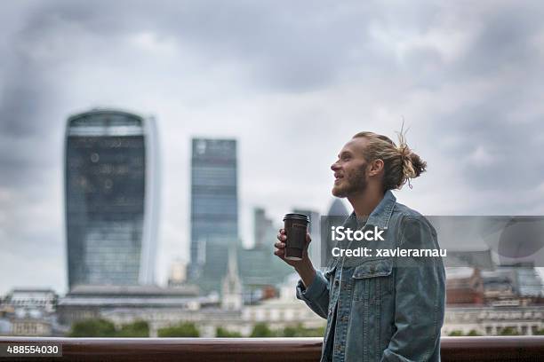 Pensive Hipster Drinking Coffee In The Street At London Stock Photo - Download Image Now