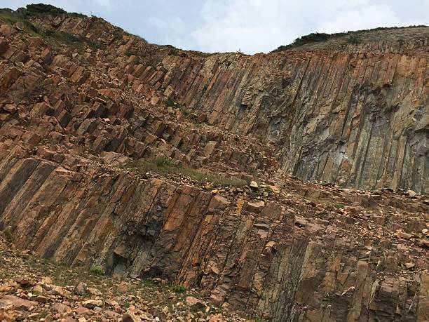 istock Hong Kong Geopark - Acidic polygonal volcanic rock columns 488554682