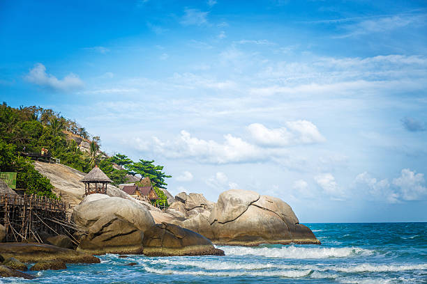 Huge rocks in the sea with a wooden hut on them