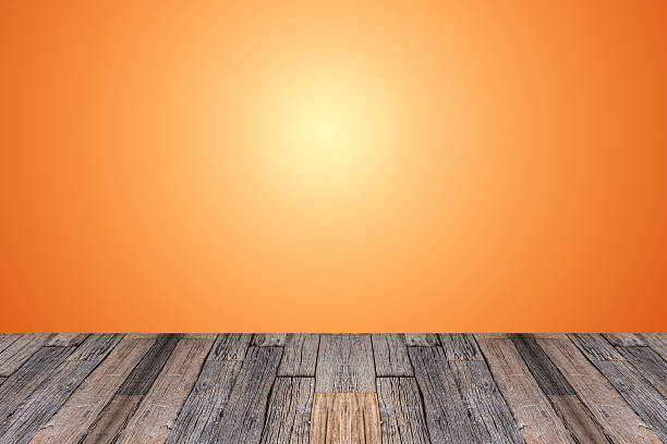 istock Wood table top on white and orange gradient abstract background 488555876