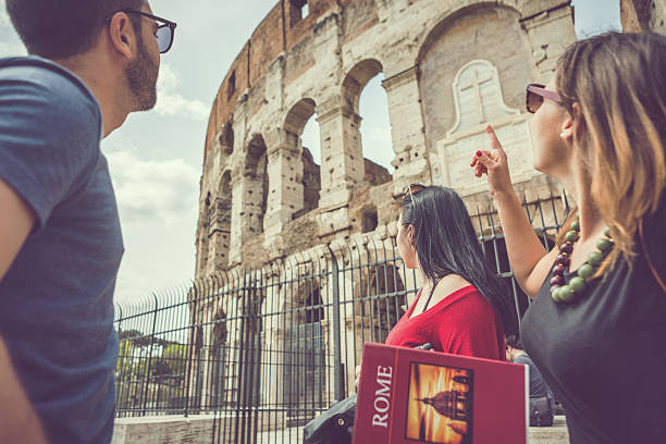istock Tourists with a guide in front of the Coliseum, Rome 488556932