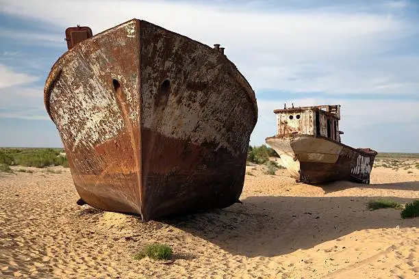 Boats in desert around Moynaq, Muynak or Moynoq - Aral sea or Aral lake - Uzbekistan - asia