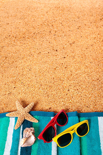 istock Beach background scene with sunglasses and starfish 488558153