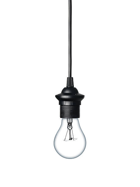 Light bulb isolated on white Close up of a lightbulb isolated on white background light bulb filament photos stock pictures, royalty-free photos & images