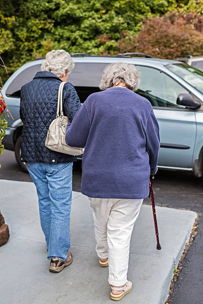 istock Daughter And Mother Walking On Restaurant Sidewalk 488559595