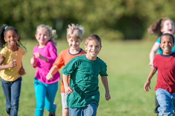 istock Kids Running Outside for Gym Class 488561576