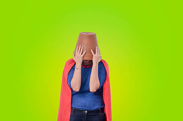 istock Woman superhero with a red cape. 488561582