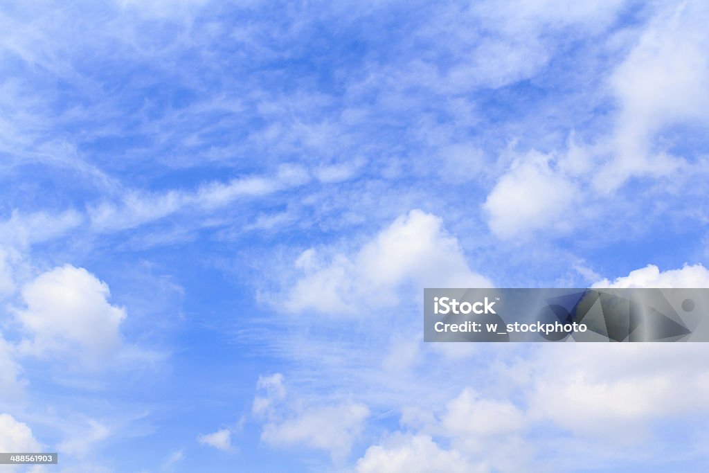 Distribution of white clouds on the clear blue sky Photo of Distribution of white clouds on the clear blue sky for background texture Abstract Stock Photo