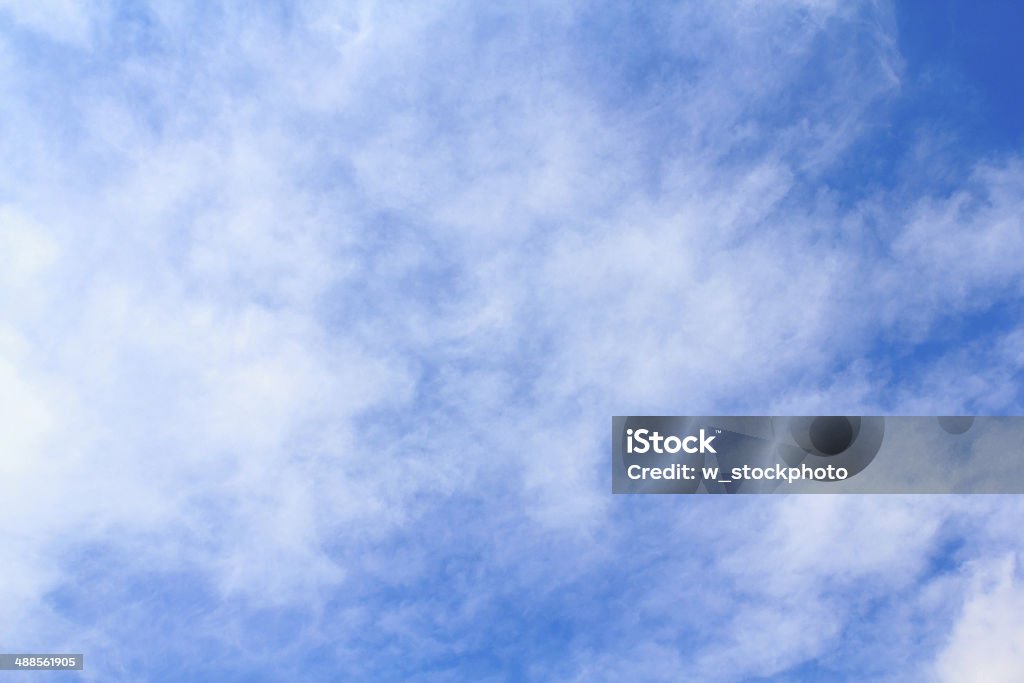 Distribution of white clouds on the clear blue sky Photo of Distribution of white clouds on the clear blue sky for background texture Abstract Stock Photo