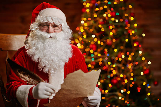 istock Joyful Santa with letter 488562316