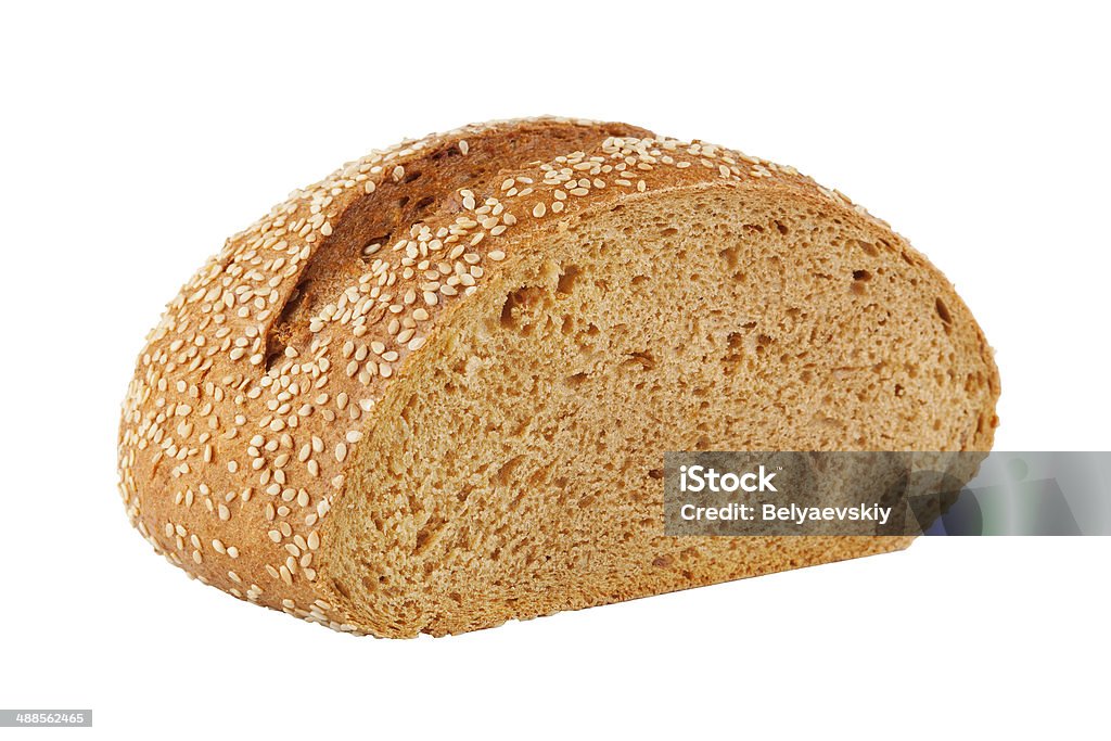 Homemade Bread With Sesame Seeds A loaf of fresh homemade bread with sesame seeds. Isolation on white Bread Stock Photo