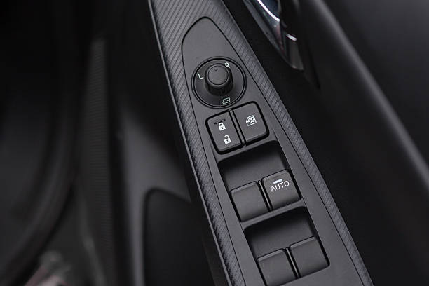 Car climate control panel for driver and passenger with shallow depth of field close up.