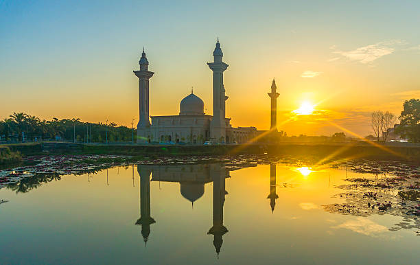 istock Mosque silhouette with sunrise background 488563125