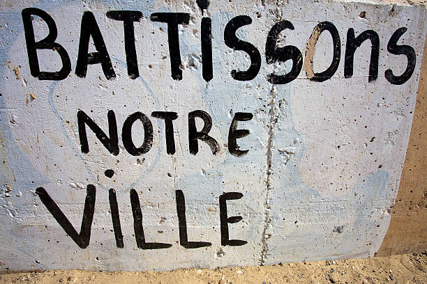 istock Lets build our city message on old wall in Senegal 488563219
