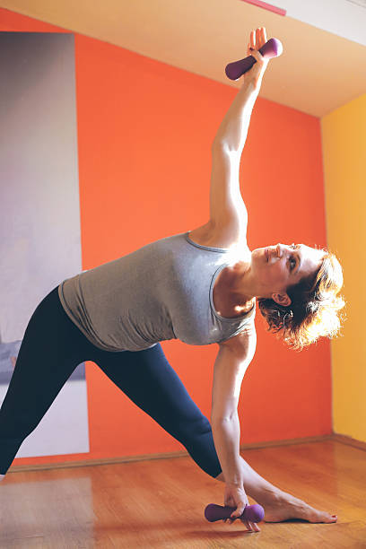 istock Beautiful pregnant woman doing exercise 488563720