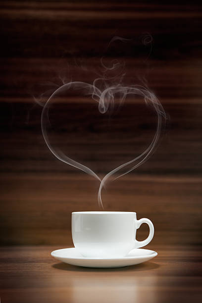 istock Cup of coffee with heart-shaped smoke 488563965