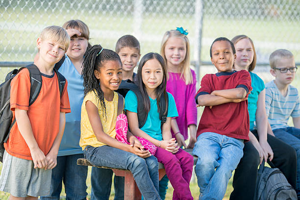 Children Sitting Outside on Bench
