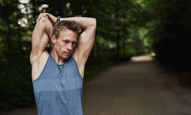 istock Athletic Man Stretching Arms Behind his Head 488565312