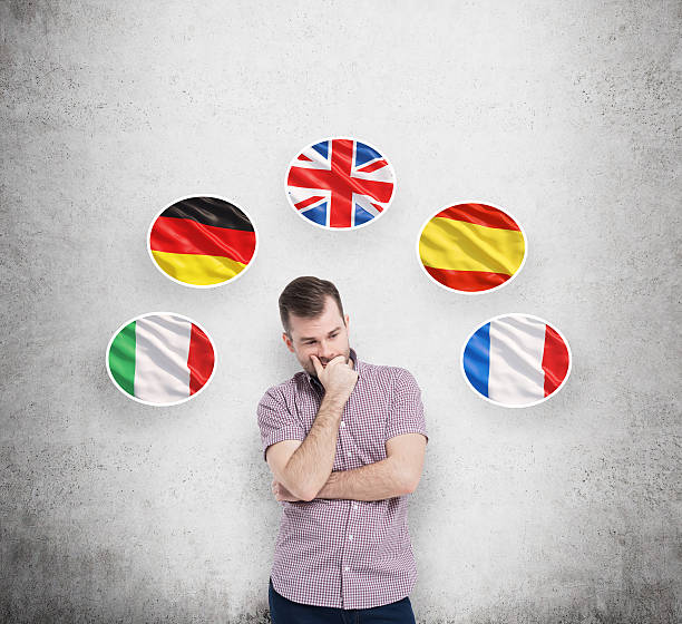 istock Young man in casual shirt holds his chin and thinks 488565928
