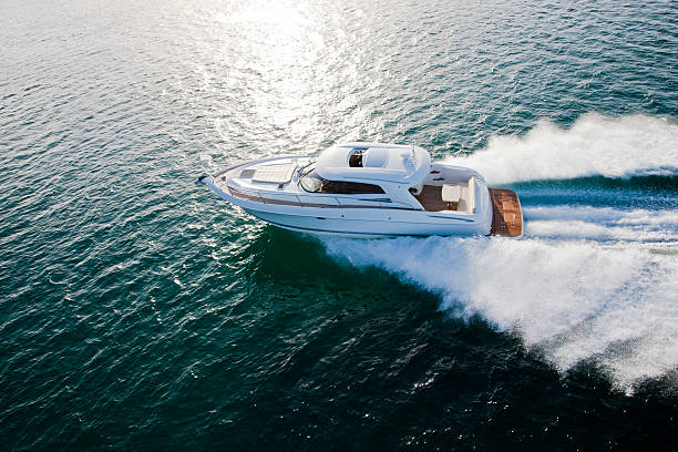 Luxurious boat racing through the ocean stock photo