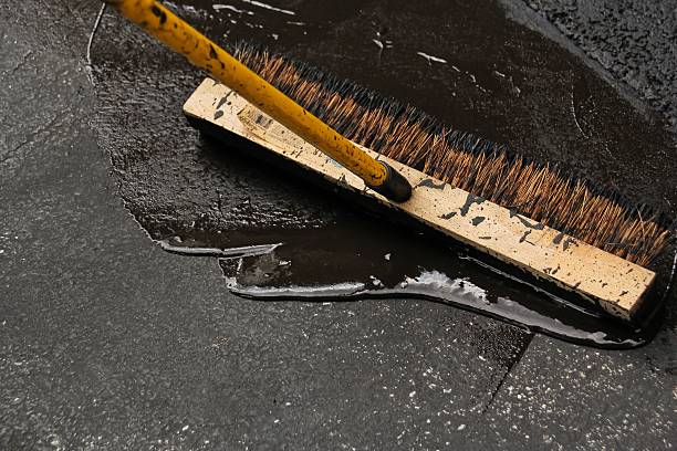 istock Asphalt Driveway sealing blacktop paving 488569308