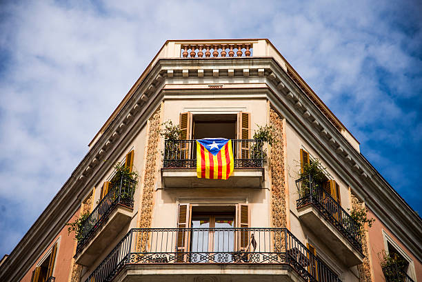 A independentist Catalonian fllag hangs down a balcony in Barcelona. The spanish province tries to get its independence from Spain.