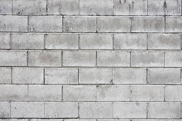 pared de piedra - bloque de cemento fotografías e imágenes de stock