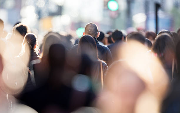 Candid business commuter crowd Heads of shoppers and commuters in a busy urban street scene. bustling city stock pictures, royalty-free photos & images