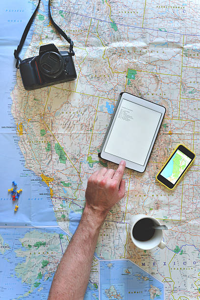 istock Young man planning a road trip 488571905