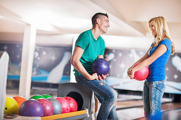 istock Cheerful couple at the bowling alley. 488573077