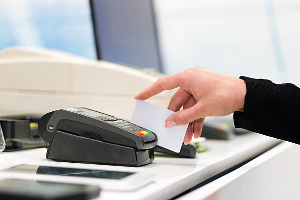 istock Swiping credit card 488573147