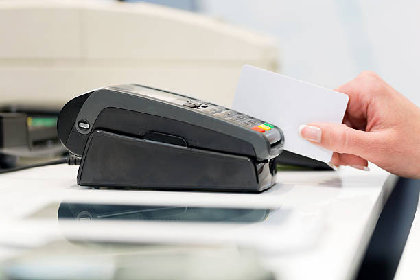 istock Swiping credit card 488573157