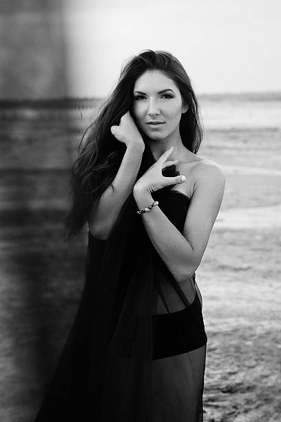 istock Young woman wrapped long piece light fabric fluttering 488573870