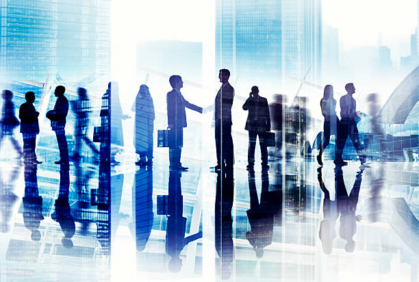 istock Abstract Image of Business Handshake in a Cityscape 488574055