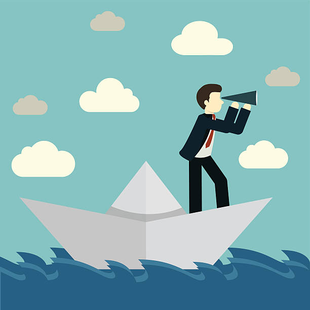istock Businessman is sailing on paper boat in ocean 488574472