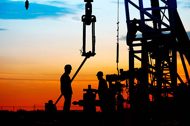 istock oil field, the oil workers are working 488574610