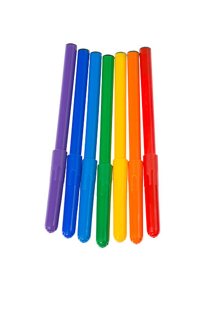 Seven felt pens lie in a row stock photo